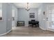 Cozy room featuring hardwood floors, a view of kitchen, and a modern chandelier at 14418 Mirabelle Vista Cir, Tampa, FL 33626