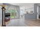 Open-concept living room leading to the kitchen and featuring doors to the outdoor space at 14418 Mirabelle Vista Cir, Tampa, FL 33626