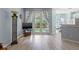 Inviting living room with hardwood floors, stylish lighting, and doors that open to a patio at 14418 Mirabelle Vista Cir, Tampa, FL 33626