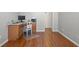 Office space with wooden floors, desk, and a view of a closet at 14418 Mirabelle Vista Cir, Tampa, FL 33626