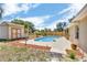Backyard oasis featuring a pool, shed, and a well-manicured landscape for outdoor enjoyment at 1536 Norwick Dr, Lutz, FL 33559