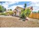 Exterior view of a one-story home and front yard with minimal landscaping and mulch at 1536 Norwick Dr, Lutz, FL 33559