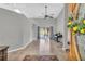 Spacious foyer with neutral tile flooring, piano, and view of the backyard pool area at 1536 Norwick Dr, Lutz, FL 33559