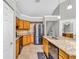 Kitchen featuring granite counters, stainless steel appliances, and wooden cabinets at 1536 Norwick Dr, Lutz, FL 33559