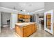 Kitchen island with granite countertops and pendant lights, with seating at 1536 Norwick Dr, Lutz, FL 33559