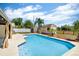 Backyard featuring a pristine pool surrounded by a well-maintained patio and lush landscaping at 1536 Norwick Dr, Lutz, FL 33559