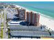 Aerial view of beachfront condos, hotels, and coastline near a busy thoroughfare at 17960 Gulf Blvd # 111, Redington Shores, FL 33708