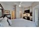 Well-appointed main bedroom with a ceiling fan, desk, tv, and an en-suite bathroom at 17960 Gulf Blvd # 111, Redington Shores, FL 33708