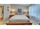 Comfortable bedroom featuring light-colored walls, a soft bed, and bedside tables offering a cozy retreat at 17960 Gulf Blvd # 111, Redington Shores, FL 33708