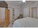 Comfortable bedroom with a ceiling fan, closet and natural light, creating a welcoming ambiance at 17960 Gulf Blvd # 111, Redington Shores, FL 33708