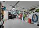 Organized garage features epoxy floors, storage racks, tool chests, and hanging bicycles at 17960 Gulf Blvd # 111, Redington Shores, FL 33708