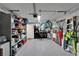 Spacious garage with epoxy floors, storage shelving, and plenty of room for parking and projects at 17960 Gulf Blvd # 111, Redington Shores, FL 33708
