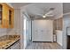 Spacious room off of the kitchen with a sliding door, ceiling fan, and ample storage at 17960 Gulf Blvd # 111, Redington Shores, FL 33708