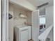 Convenient laundry area with washer and dryer hookups and storage space, located upstairs at 17960 Gulf Blvd # 111, Redington Shores, FL 33708