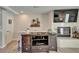 Living room showcasing a fireplace, entertainment center, decor, and light wood-look floors at 17960 Gulf Blvd # 111, Redington Shores, FL 33708