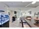 Bright and airy living space connecting the dining area and living room, complete with balcony access at 17960 Gulf Blvd # 111, Redington Shores, FL 33708