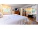 Bedroom featuring double beds, a mirrored closet, and bright natural light at 1880 Belleair Rd, Clearwater, FL 33764