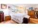 Comfortable bedroom showcasing natural wood furniture and a cozy, inviting atmosphere at 1880 Belleair Rd, Clearwater, FL 33764
