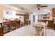 Comfortable dining area with a wooden table set, a large buffet, and tiled floors at 1880 Belleair Rd, Clearwater, FL 33764