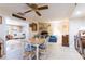 Cozy dining room with a brick fireplace, country home sign and an adjacent sitting area at 1880 Belleair Rd, Clearwater, FL 33764