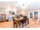 The dining room is adjacent to an updated kitchen with views of an outdoor living space at 1880 Belleair Rd, Clearwater, FL 33764