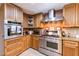 Well-equipped kitchen features stainless steel appliances, custom cabinets, and a stylish brick backsplash at 1880 Belleair Rd, Clearwater, FL 33764
