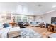 Inviting living room featuring hardwood floors, comfortable seating, and bright natural light at 1880 Belleair Rd, Clearwater, FL 33764