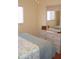 Neutral toned bedroom with large mirror and dresser set at 1942 Settlement Rd # 25, Venice, FL 34285