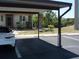 Carport parking space with a view of the condo's front door at 1942 Settlement Rd # 25, Venice, FL 34285