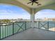 Enjoy the stunning waterfront views from this covered balcony with black railings at 211 Dolphin Pt # 403, Clearwater Beach, FL 33767