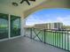 Balcony view features iron railing and sliding glass doors with a waterfront view at 211 Dolphin Pt # 403, Clearwater Beach, FL 33767
