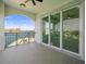 Balcony view features iron railing and sliding glass doors with a waterfront view at 211 Dolphin Pt # 403, Clearwater Beach, FL 33767