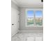 Bright bedroom featuring a modern door and a large window with a water view at 211 Dolphin Pt # 403, Clearwater Beach, FL 33767