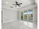 Bright, spacious bedroom with tile floors and large sliding glass doors to balcony and city views at 211 Dolphin Pt # 403, Clearwater Beach, FL 33767