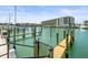 This waterfront view features a dock with boat slips at 211 Dolphin Pt # 403, Clearwater Beach, FL 33767