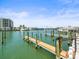Waterfront view of the dock with boat slips on a sunny day at 211 Dolphin Pt # 403, Clearwater Beach, FL 33767