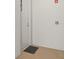 Apartment door with unit number and fire safety system on a neutral wall at 211 Dolphin Pt # 403, Clearwater Beach, FL 33767