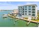 Beautiful building with a pool, docks and boats creating a relaxing waterfront living at 211 Dolphin Pt # 403, Clearwater Beach, FL 33767
