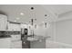 This spacious kitchen features an island, modern appliances, and sleek countertops at 211 Dolphin Pt # 403, Clearwater Beach, FL 33767