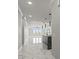 Bright living room featuring kitchen and water view at 211 Dolphin Pt # 403, Clearwater Beach, FL 33767