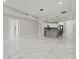 Open concept living space with a kitchen and marble floors, that gives access to other areas of the home at 211 Dolphin Pt # 403, Clearwater Beach, FL 33767