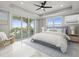 Inviting primary bedroom with balcony access and serene city views at 211 Dolphin Pt # 403, Clearwater Beach, FL 33767