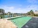 Waterfront swimming pool with dock and water views at 211 Dolphin Pt # 403, Clearwater Beach, FL 33767