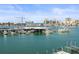 Picturesque waterfront view showcasing the marina, boats, and city skyline at 211 Dolphin Pt # 403, Clearwater Beach, FL 33767