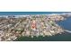Aerial view of waterfront community with homes, docks, and boats along the water at 233 45Th Ave, St Pete Beach, FL 33706