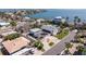 Aerial view of a coastal home with solar panels near the water at 233 45Th Ave, St Pete Beach, FL 33706