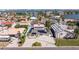 The home features solar panels and a driveway with space for multiple vehicles, in a coastal community at 233 45Th Ave, St Pete Beach, FL 33706