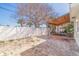This backyard features a brick-paved patio and a covered outdoor seating area for relaxing at 233 45Th Ave, St Pete Beach, FL 33706