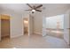 Bedroom with a ceiling fan, tile floors and access to an en suite bathroom at 233 45Th Ave, St Pete Beach, FL 33706