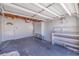 Spacious garage featuring ample storage space, a utility sink, and an automatic garage door opener at 233 45Th Ave, St Pete Beach, FL 33706